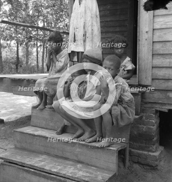 Turpentine worker's family near Cordele, Alabama, 1936. Creator: Dorothea Lange.