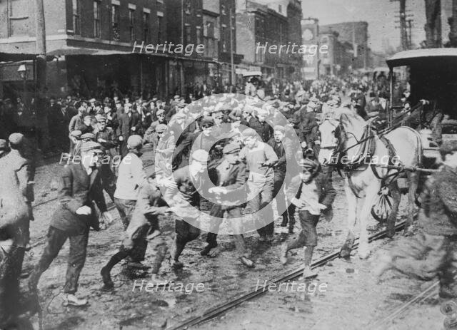 Rioters charging horse-drawn car, later wrecking it on Kensington Ave., Philadelphia, 1910. Creator: Bain News Service.