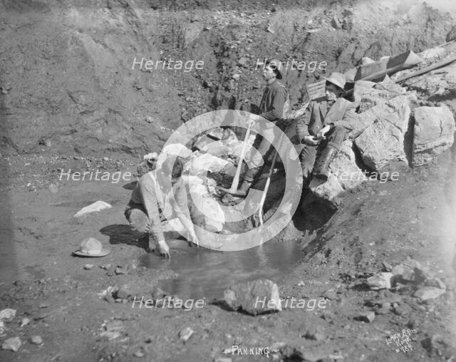 Men panning gold, between c1900 and 1927. Creator: Lomen Brothers.