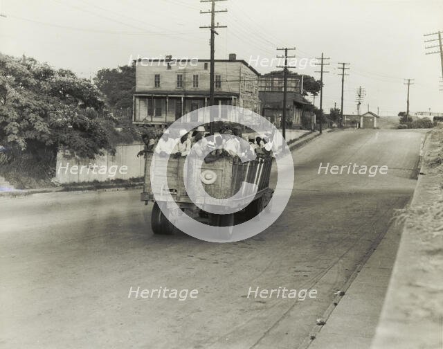 The last truckload of cotton hoers from Memphis bound for the Wilson Cotton..., June 1937. Creators: Farm Security Administration, Dorothea Lange.