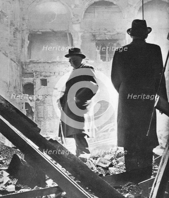 'Mr. Churchill contemplates the ruins of the House of Commons, bombed in May 1941', 1941 Artist: Unknown.