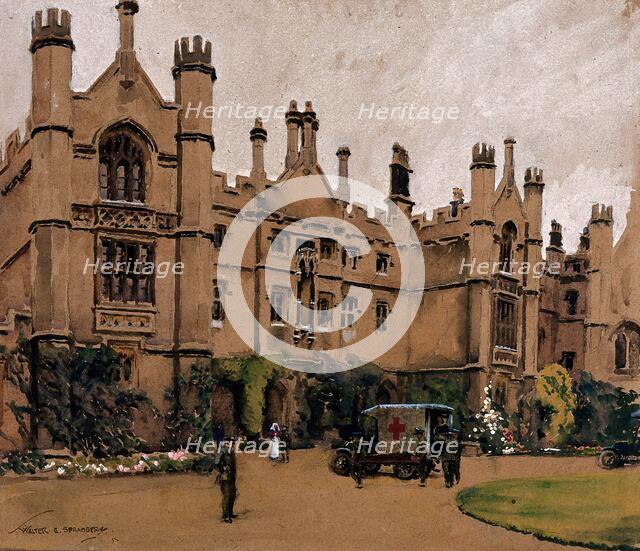 World War I: a neo-Gothic building used as a hospital, with an ambulance.., c1910s. Creator: Walter Ernest Spradbery.