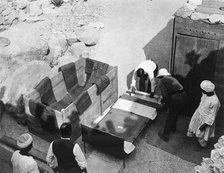 Archaeologists working  at the Tomb of Tutankhamun, Valley of the Kings, Egypt, 1922. Artist: Harry Burton