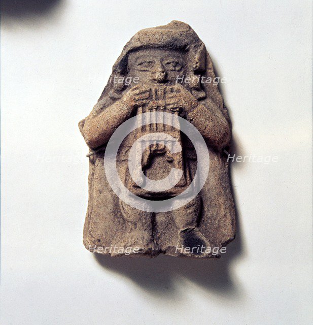 Pottery Figure of Man with Pan Pipes, from Coumbia, Pre Columbian. Artist: Unknown.