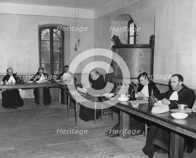 Monks at dinner in the refectory, Asile St Leon, France, c1947-1951. Artist: Unknown