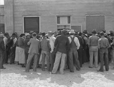 Waiting for relief checks, Calipatria, California, 1937. Creator: Dorothea Lange.