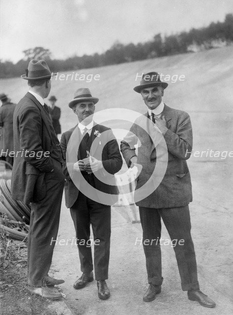 John Portwine and Selwyn Edge of AC Cars at Brooklands motor racing circuit, Surrey, c1921. Artist: Bill Brunell.