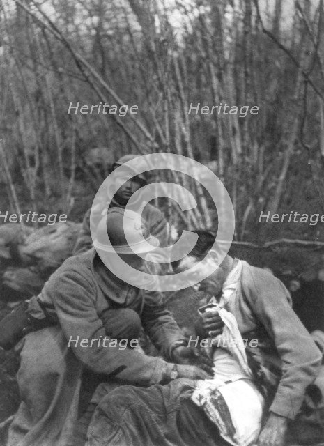 A French soldier's wounds are treated, World War I, France, 1916. Artist: Unknown