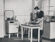'A British kitchen equipped with a cabinet gas cooker', 1942.  Artist: Unknown.