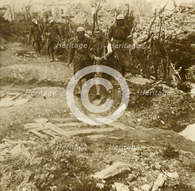 Wounded French infantrymen arriving at Chateau d'Esnes, Verdun, northern France, 1916. Artist: Unknown.