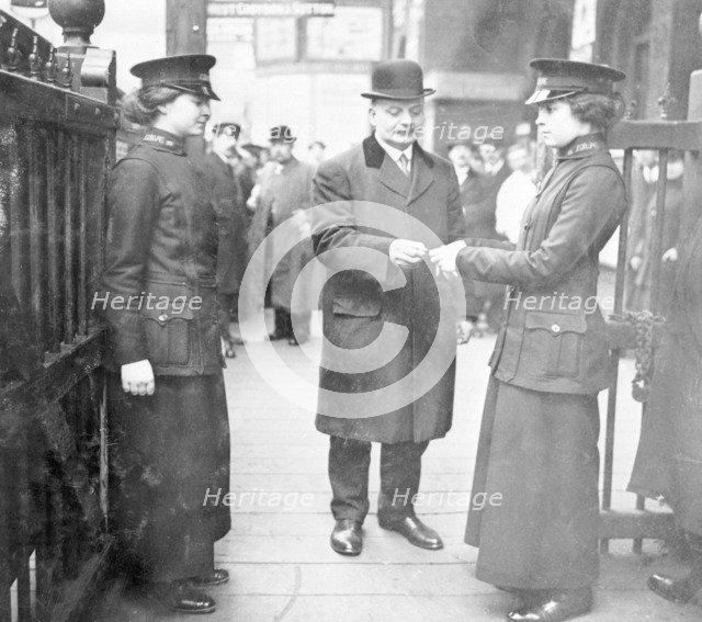 Women ticket collectors, London Bridge Station, London, May 1915. Artist: Unknown