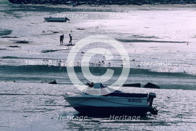 Boat at low tide, Port-en-Bessin, Normandy, France.