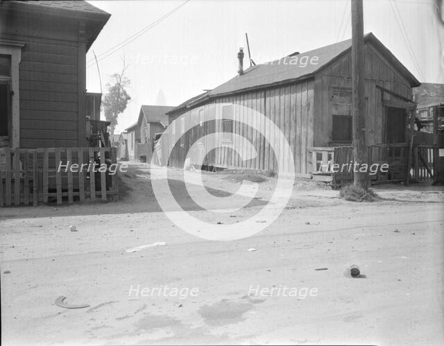 Mexican quarter of Los Angeles, one quarter mile from City Hall, California, 1936. Creator: Dorothea Lange.