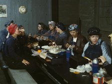 Women workers employed as wipers in the roundhouse having lunch..., C&NWRR., Clinton, Iowa, 1943. Creator: Jack Delano.