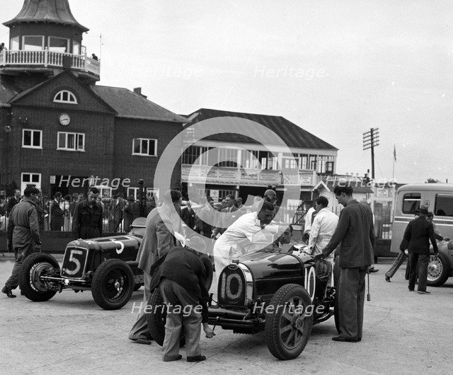 ERA and Charles Mortimer's Bugatti Type 35B at Brooklands, Surrey, 1939. Artist: Bill Brunell.