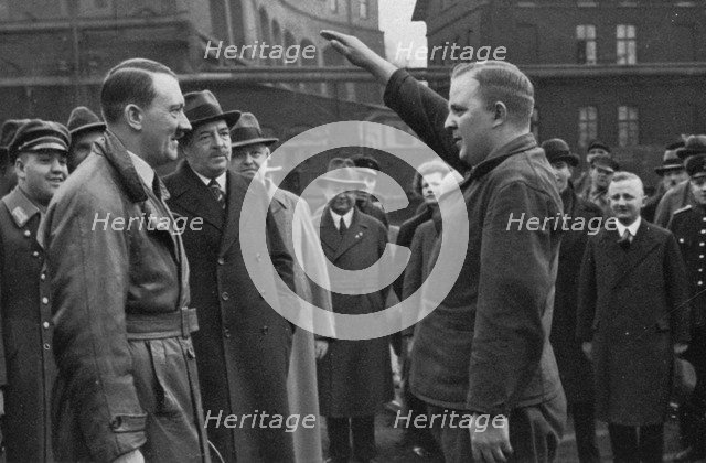 Adolf Hitler saluted by a representative of the staff of a factory, Germany, 1936. Artist: Unknown
