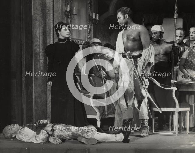 Rex Ingram, shirtless, with dead man, 1938. Creator: Unknown.