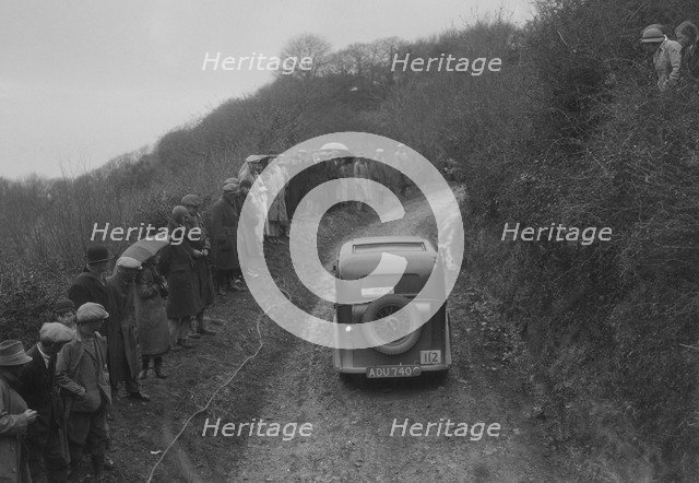 Standard saloon of AG Jones competing in the MCC Lands End Trial, 1935. Artist: Bill Brunell.