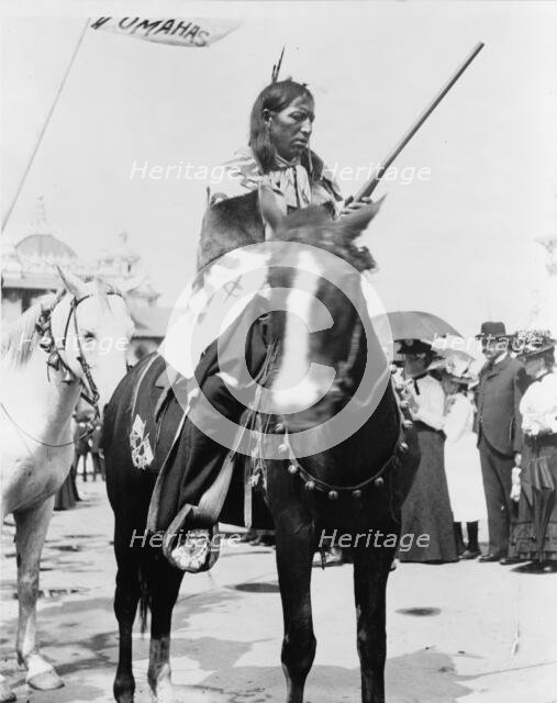 Indian, holding gun, on horse, at the Pan-American Exposition, Buffalo, New York, 1901. Creator: Frances Benjamin Johnston.