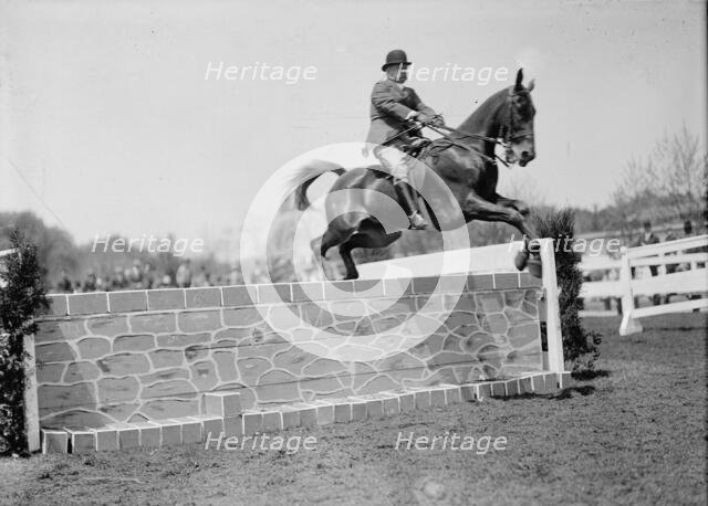 Horse Shows - Col. A.W. Dunn, Hurdling, 1911. Creator: Harris & Ewing.