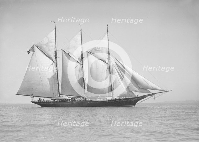 The three-mast auxiliary schooner 'Invincible', 1911. Creator: Kirk & Sons of Cowes.