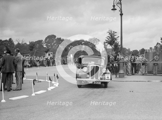 Standard 12 saloon of Miss I Webber competing in the South Wales Auto Club Welsh Rally, 1937 Artist: Bill Brunell.