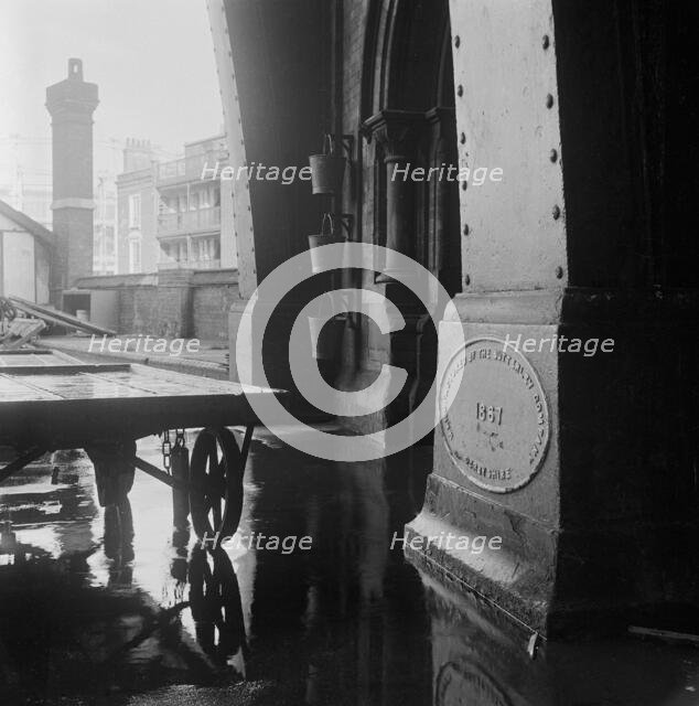 A Butterley Iron Company plaque dated 1867 located on a plinth...St Pancras Station, 1960-72. Creator: John Gay.