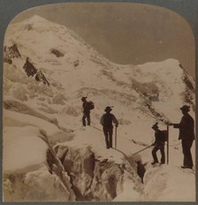 'Ascent of Mt. Blanc - crossing Bossons Glacier - Grands Mulets in distance, Alps', 1901. Creator: Underwood & Underwood.