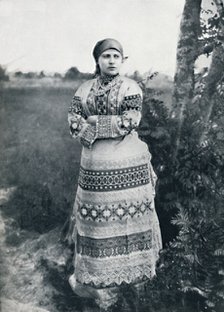 A Russian peasant in costume, 1912. Artist: Unknown.