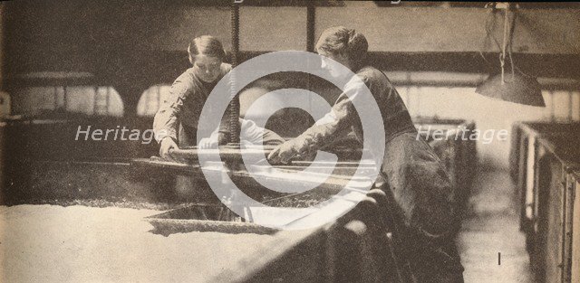 Screwing Down the Yeast in a Burton-On-Trent Brewery', c1916, (1935). Artist: Unknown.