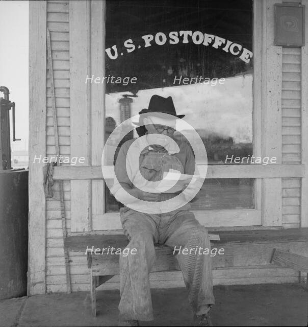 Man in front of post office, Carey, Texas, 1937. Creator: Dorothea Lange.