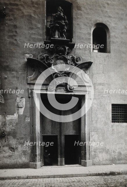 Hospital de la Santa Cruz, Barcelona: the doorway.. with a statue of Charity..., c1900s. Creator: Unknown.