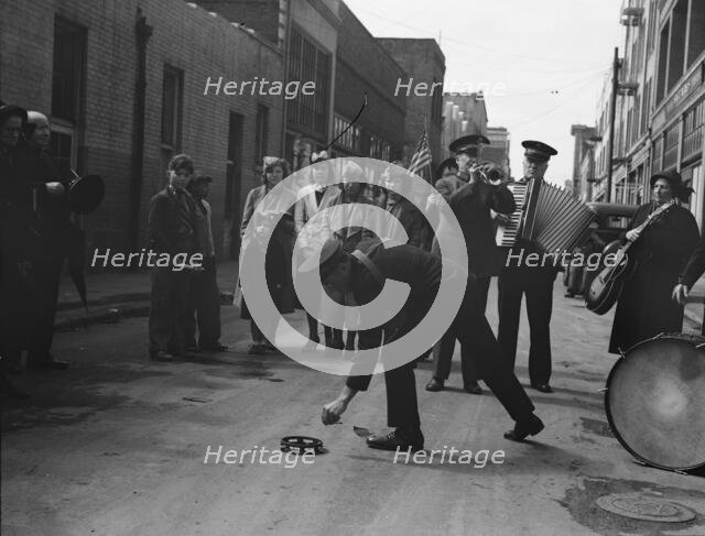 Army contributes first to the tambourine..., Salvation Army, San Francisco, California, 1939. Creator: Dorothea Lange.