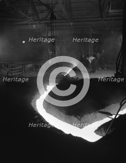 Molten steel being channelled at the Stanton Steel Works, Ilkeston, Derbyshire, 1962.  Artist: Michael Walters