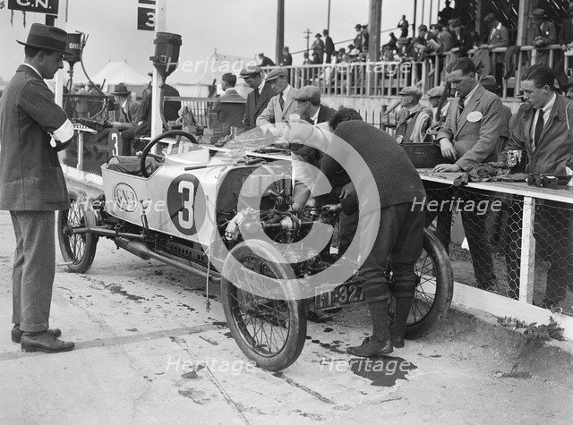 Changing a piston on Archie Frazer-Nash's GN at the JCC 200 Mile Race, Brooklands, Surrey, 1922. Artist: Bill Brunell.