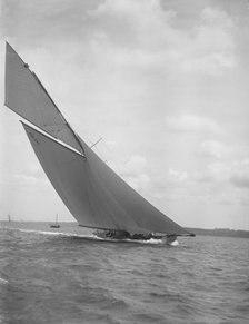 The 15 Metre sailing yacht 'Jeano' making good headway, 1911. Creator: Kirk & Sons of Cowes.