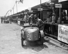 Vernon Balls and AB Gilbert's Austin Ulster at the JCC Double Twelve race, Brooklands, 8/9 May 1931. Artist: Bill Brunell.