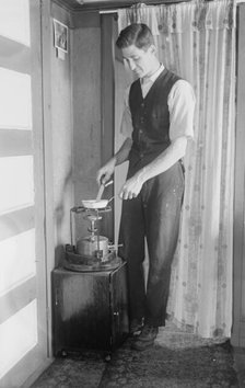 At Broad Channel - the oil stove, between c1910 and c1915. Creator: Bain News Service.