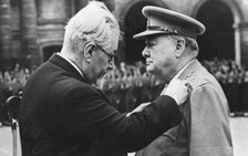 Winston Churchill receiving a military medal from Paul Ramadier, Paris, 1947. Artist: Unknown