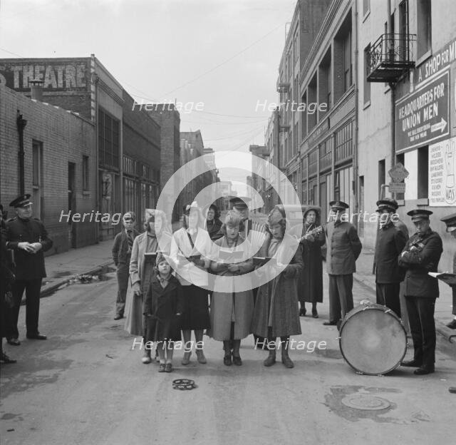 Girls' Sunday school class sings between preaching, Salvation Army, San Francisco, California, 1939. Creator: Dorothea Lange.