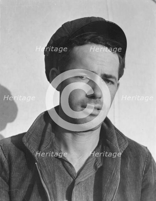 Son-in law of migratory family in FSA labor camp, Calipatria, Imperial Valley, California, 1939. Creator: Dorothea Lange.