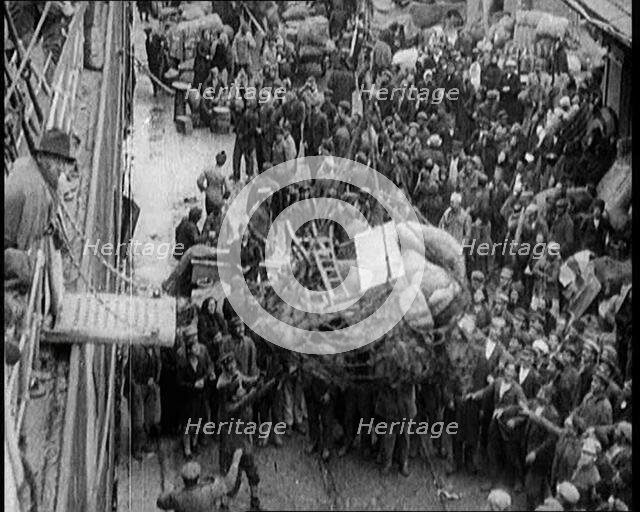 Greek People Jostling for Red Cross Food Hand Outs, 1922. Creator: British Pathe Ltd.