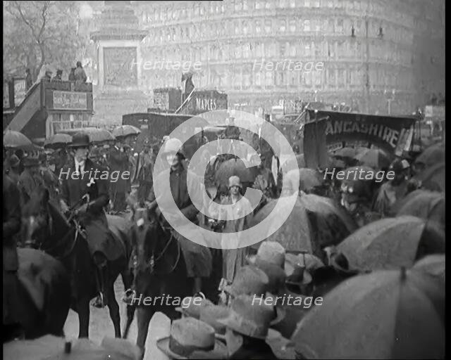 Female Civilians on Horseback Demonstrating in London Against Continuous Strikes in the Rain, 1926. Creator: British Pathe Ltd.