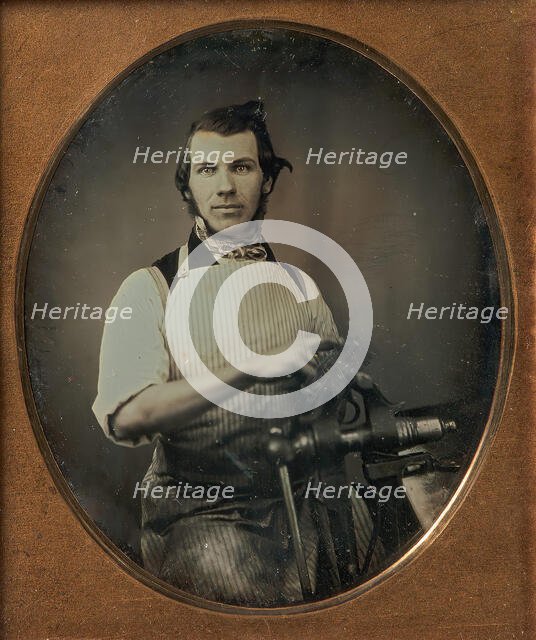 Metalworker in Apron Working with a Vise, 1840s-50s. Creator: Unknown.