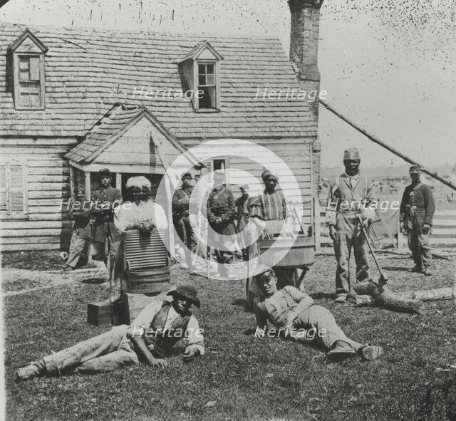 Group of contrabands at Allen's farm house near Williamsburg Road, in the vicinity..., May 1862. Creator: James F. Gibson.
