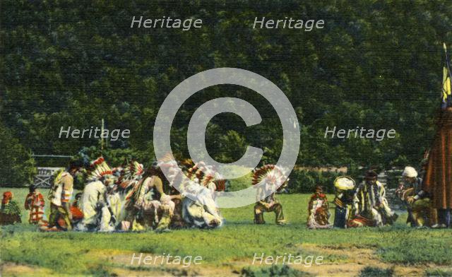 'Cherokee Indians in Full Native Costume in one of their Ceremonial Dances - On Cherokee Indian Rese Creator: Unknown.