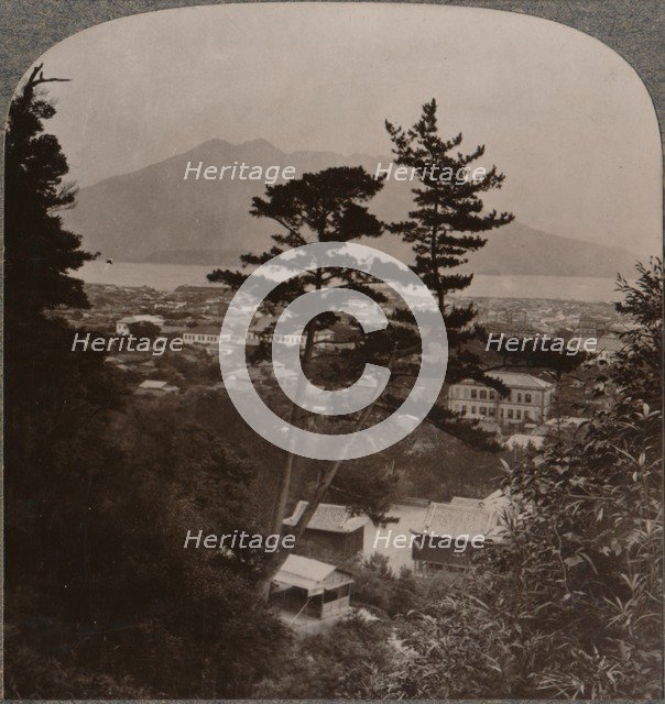 'Vista from hills above Kagoshima over Lake to distant Sakurajima volcano, Japan', 1904. Artist: Unknown.