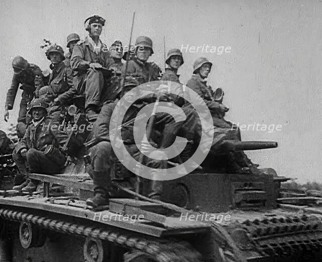 German Soldiers Riding Tanks, 1941. Creator: British Pathe Ltd.