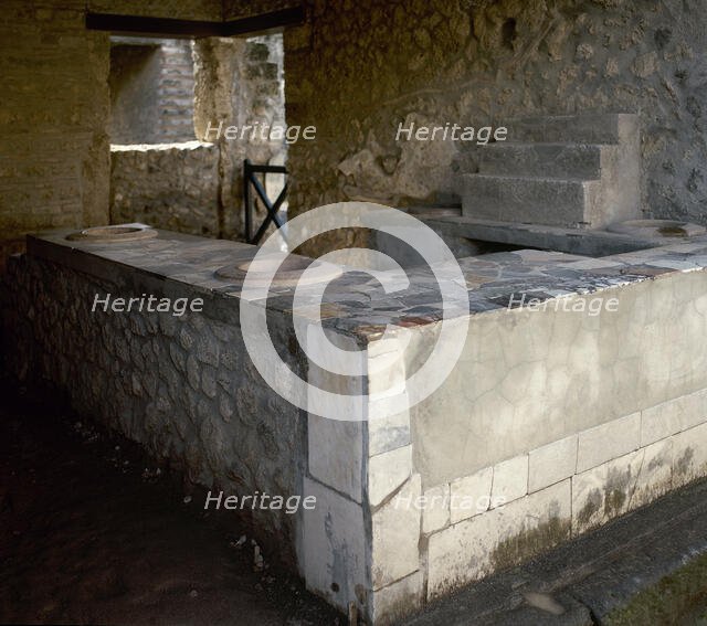 Thermopolium, commercial establishment (restaurant), Herculaneum, Italy, 2002.  Creator: LTL.