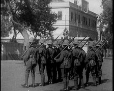 Soldiers Carrying Rifles Patrolling Outside the Egyptian Palace After the Assassination of ..., 1924 Creator: British Pathe Ltd.